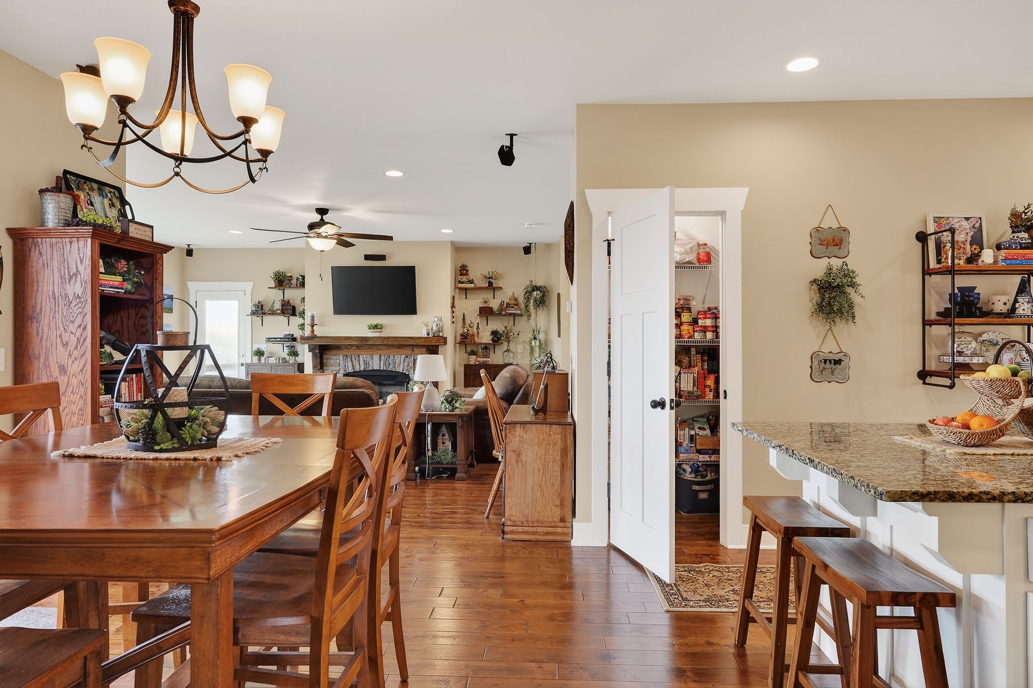 195 Coventry Way Smithville, TN 37166 - Photo 22 of 62 a view of a dining room with furniture a kitchen and chandelier