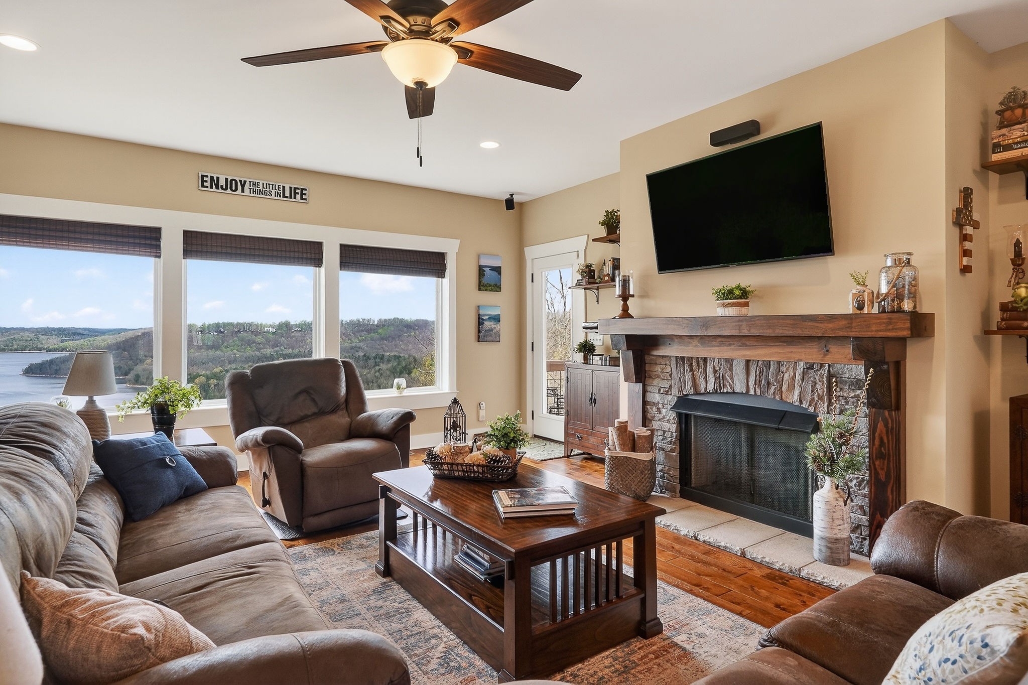 195 Coventry Way Smithville, TN 37166 - Photo 8 of 62 a living room with furniture a flat screen tv and a fireplace