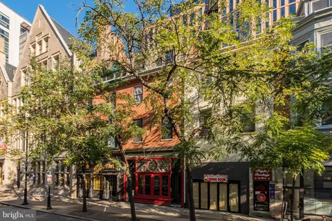 a view of shops on a street