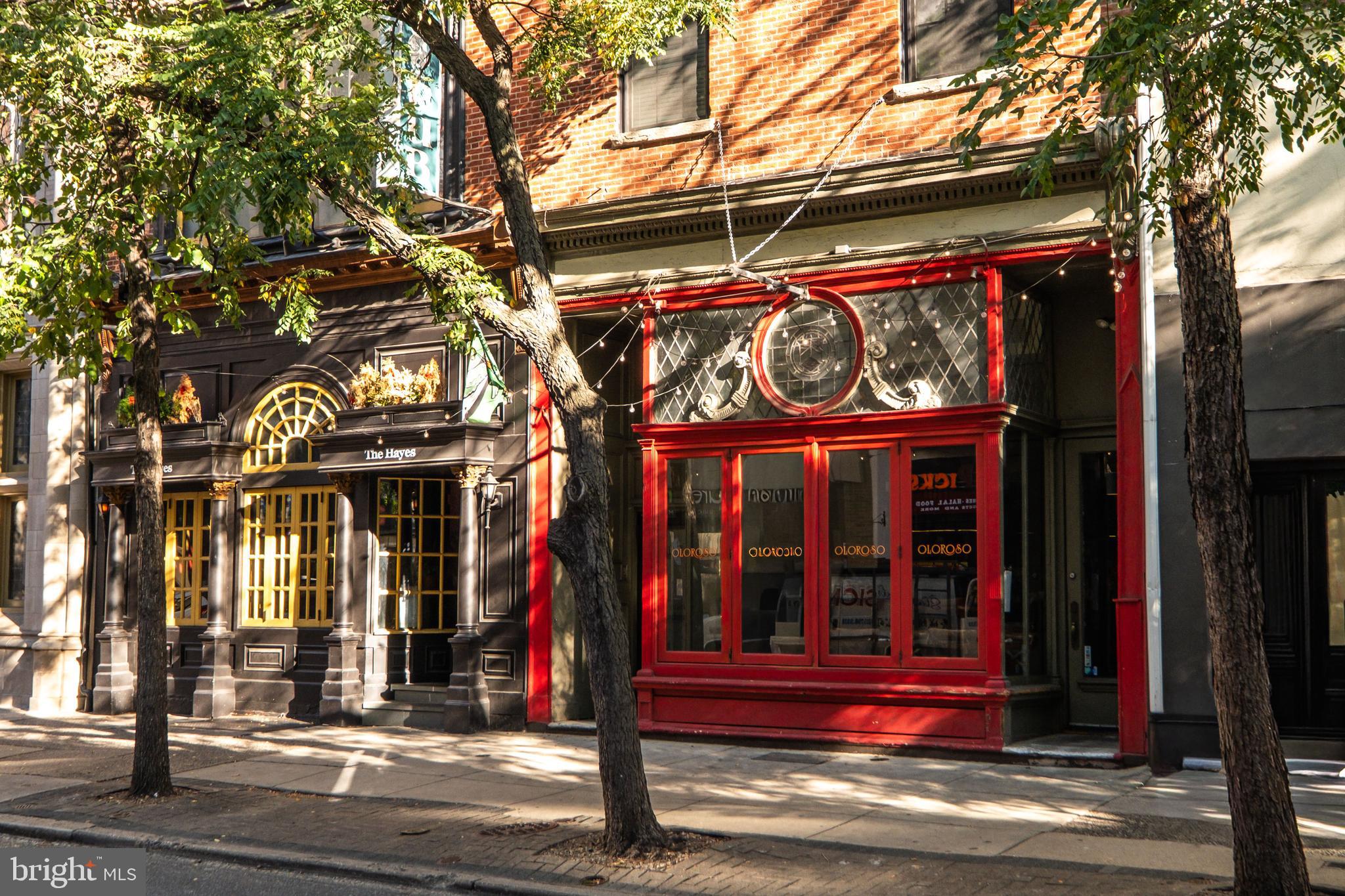 1121 Walnut Street Philadelphia, PA 19107 - Photo 2 of 38 a view of shops on a street