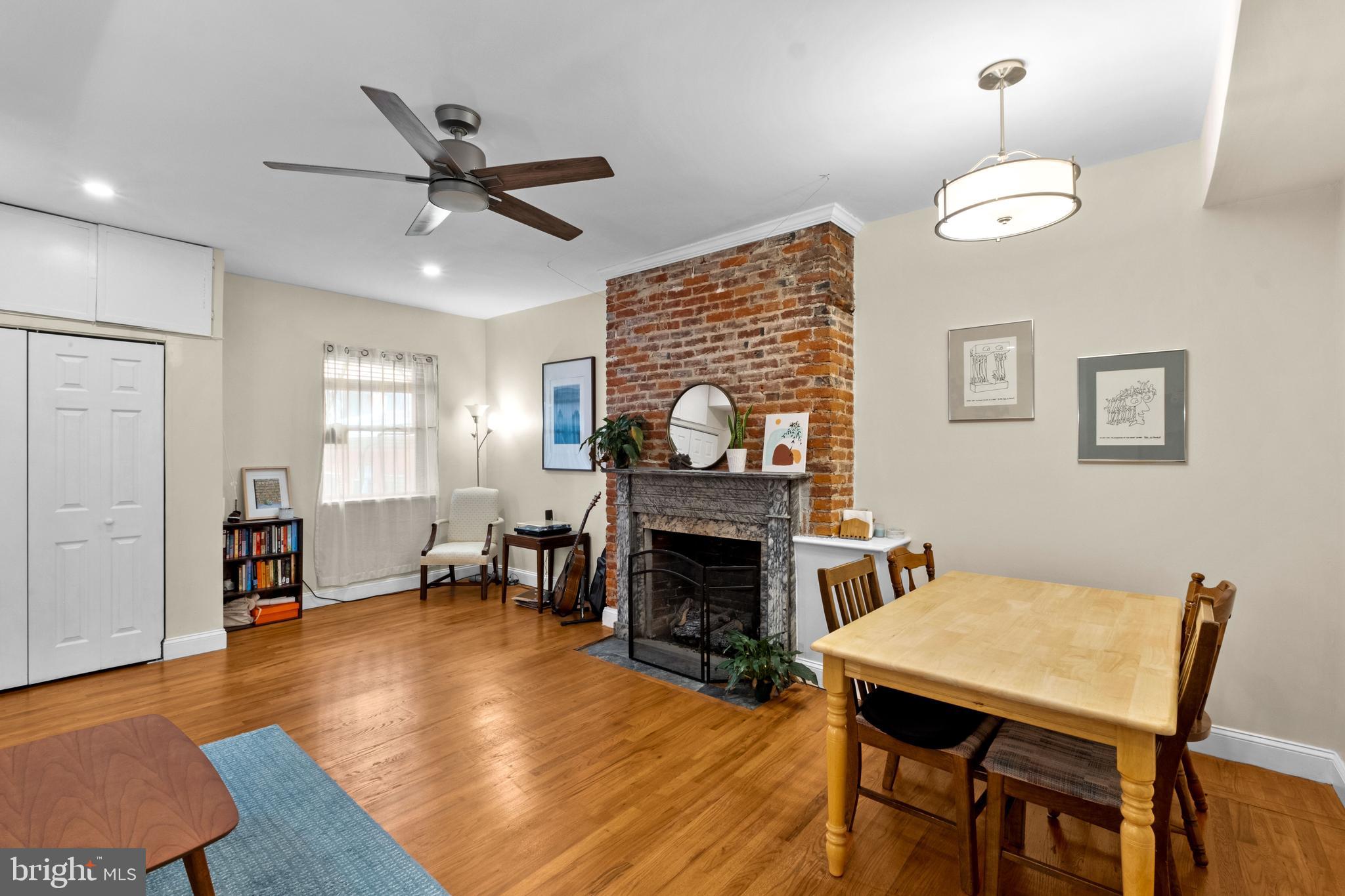 1121 Walnut Street Philadelphia, PA 19107 - Photo 21 of 38 a livingroom with fireplace dining area and a couch