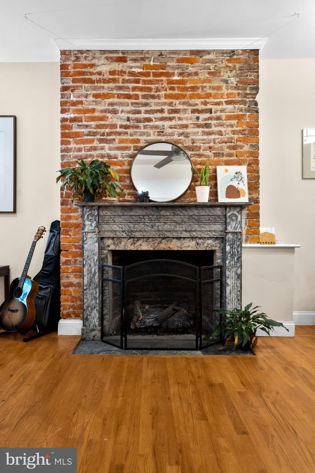 1121 Walnut Street Philadelphia, PA 19107 - Photo 23 of 38 a living room with furniture a fireplace and a table