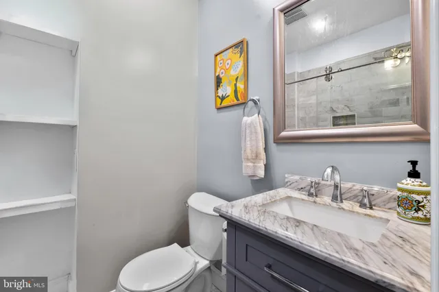 a kitchen with stainless steel appliances granite countertop white cabinets stove a sink and dishwasher