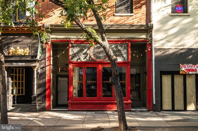 a view of a brick building with large windows