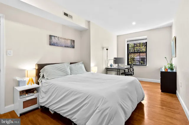 a workspace with furniture and a potted plant