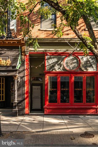 a picture of a room with furniture and a window