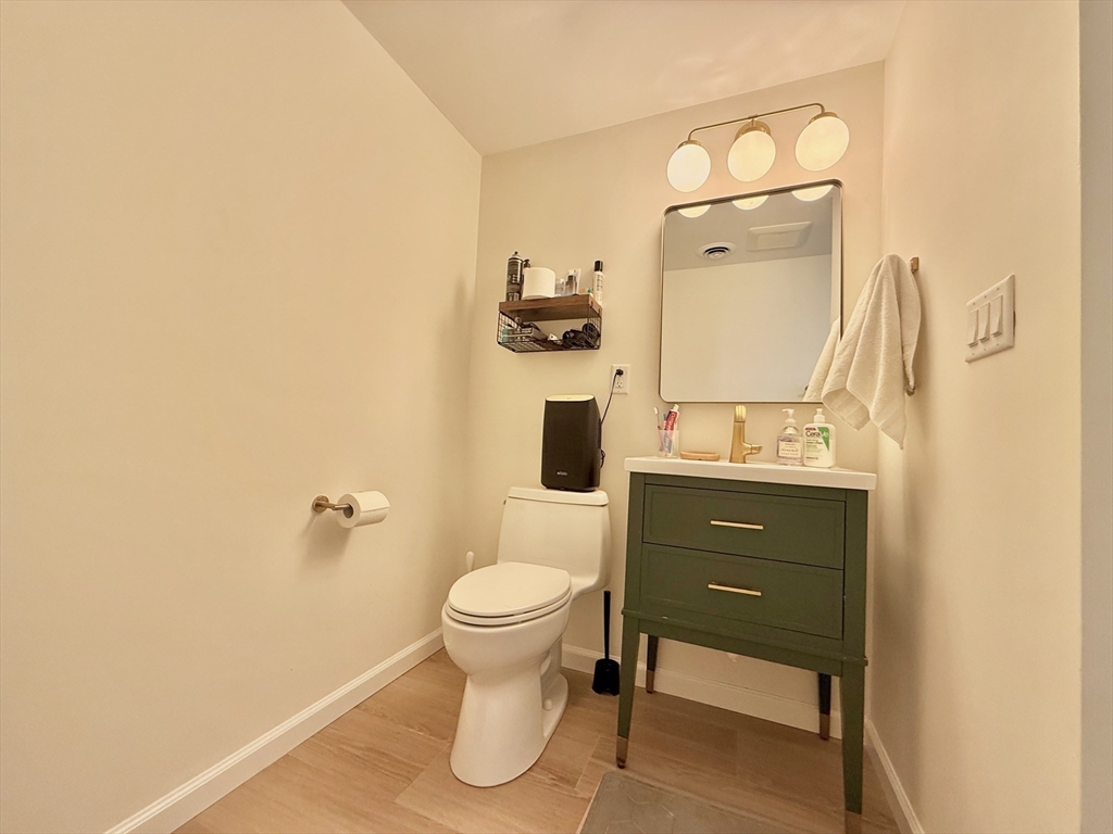 20 Stearns Road, Unit 45 Brookline, MA 02446 - Photo 13 of 22 a bathroom with a sink a toilet and mirror