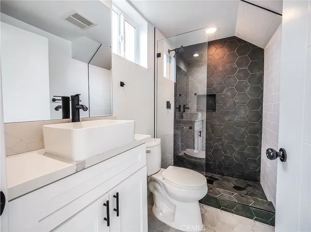 a view of a storage & utility room with a window