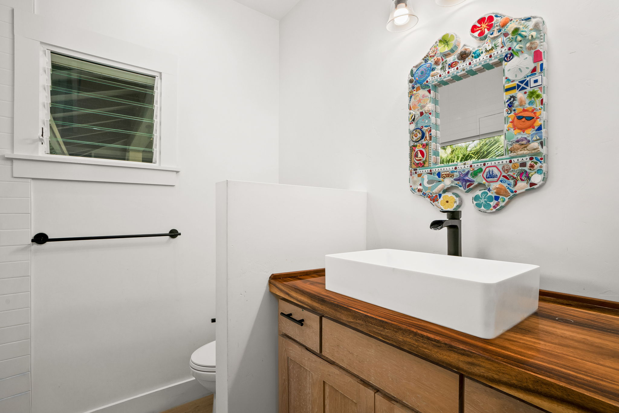 7330 Alealea Road Hanalei, HI 96714 - Photo 13 of 24 a bathroom with a sink toilet and a mirror