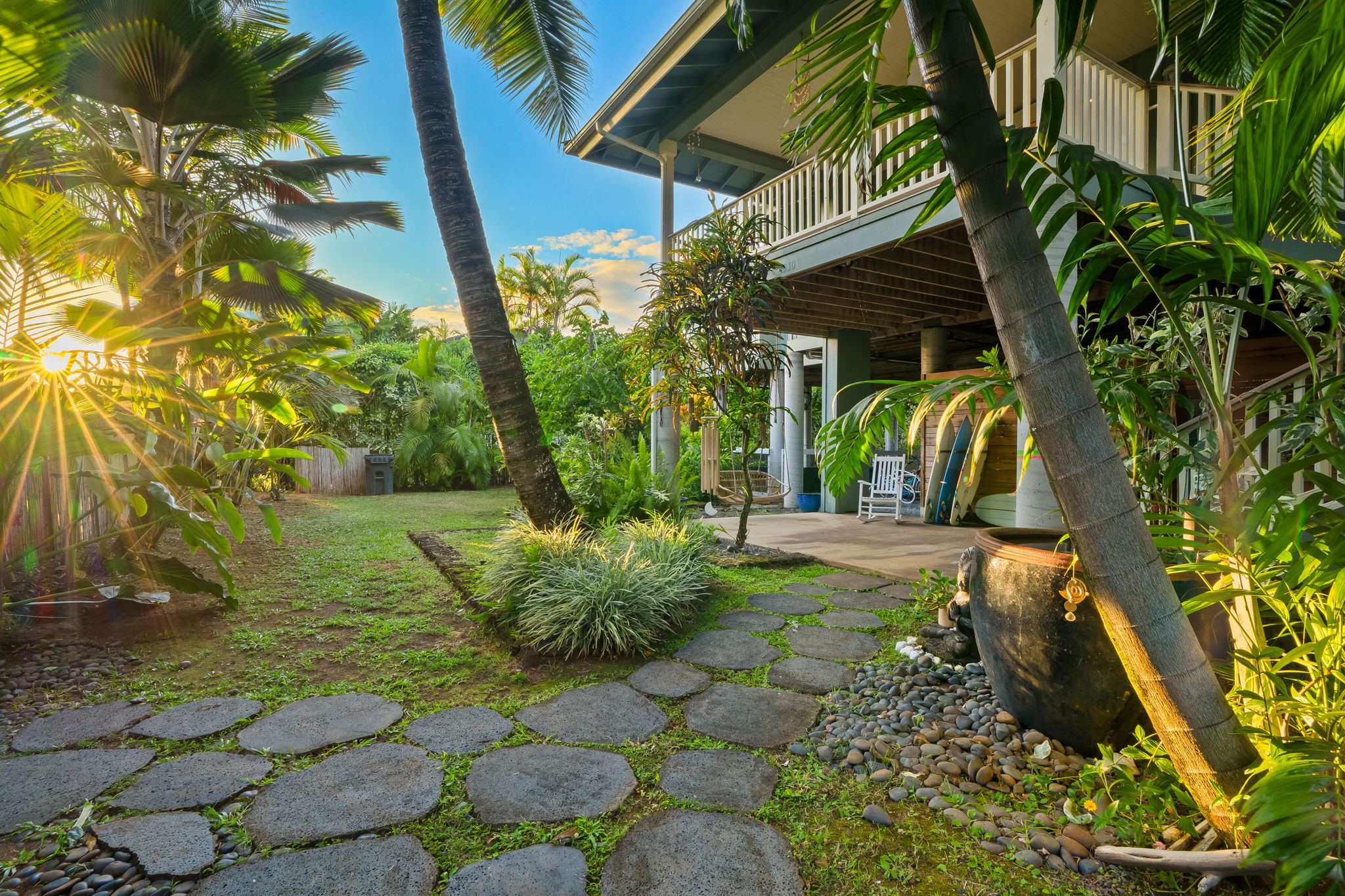 7330 Alealea Road Hanalei, HI 96714 - Photo 15 of 24 a view of a backyard with plants and a patio