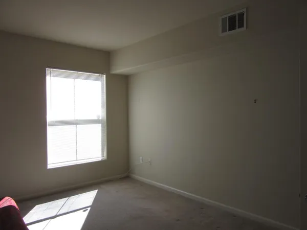 a living room with furniture and a walk in closet