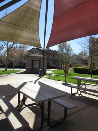 a view of a patio with swimming pool table and chairs