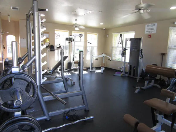 a front view of a house with a yard and fence