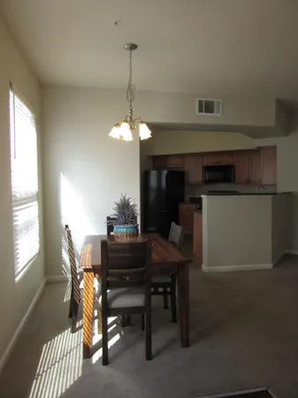 a view of a livingroom with furniture and a window