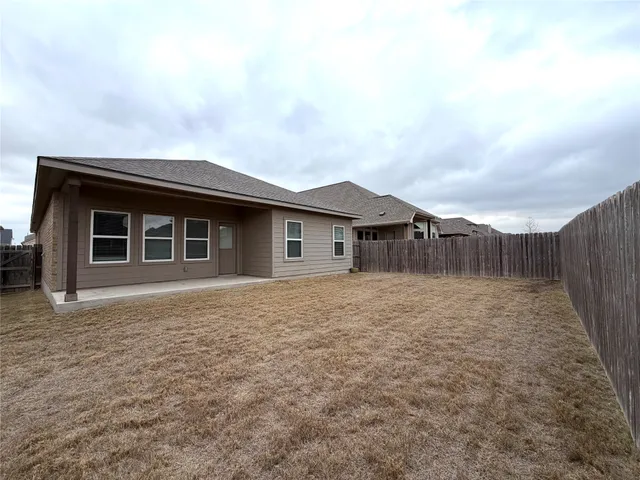 a house view with a backyard space