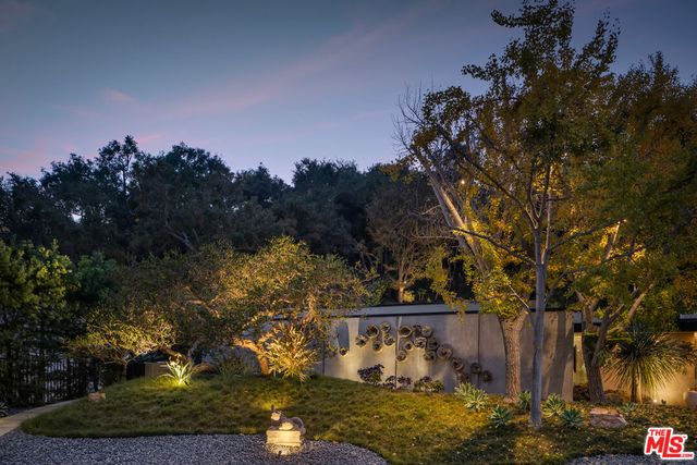 a view of a large body of water with a house in the background