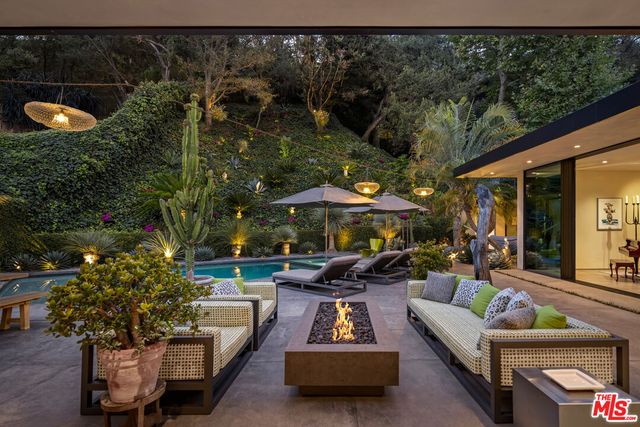 a outdoor living space with furniture and city view