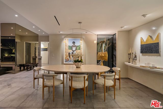 a view of a dining room with furniture and window