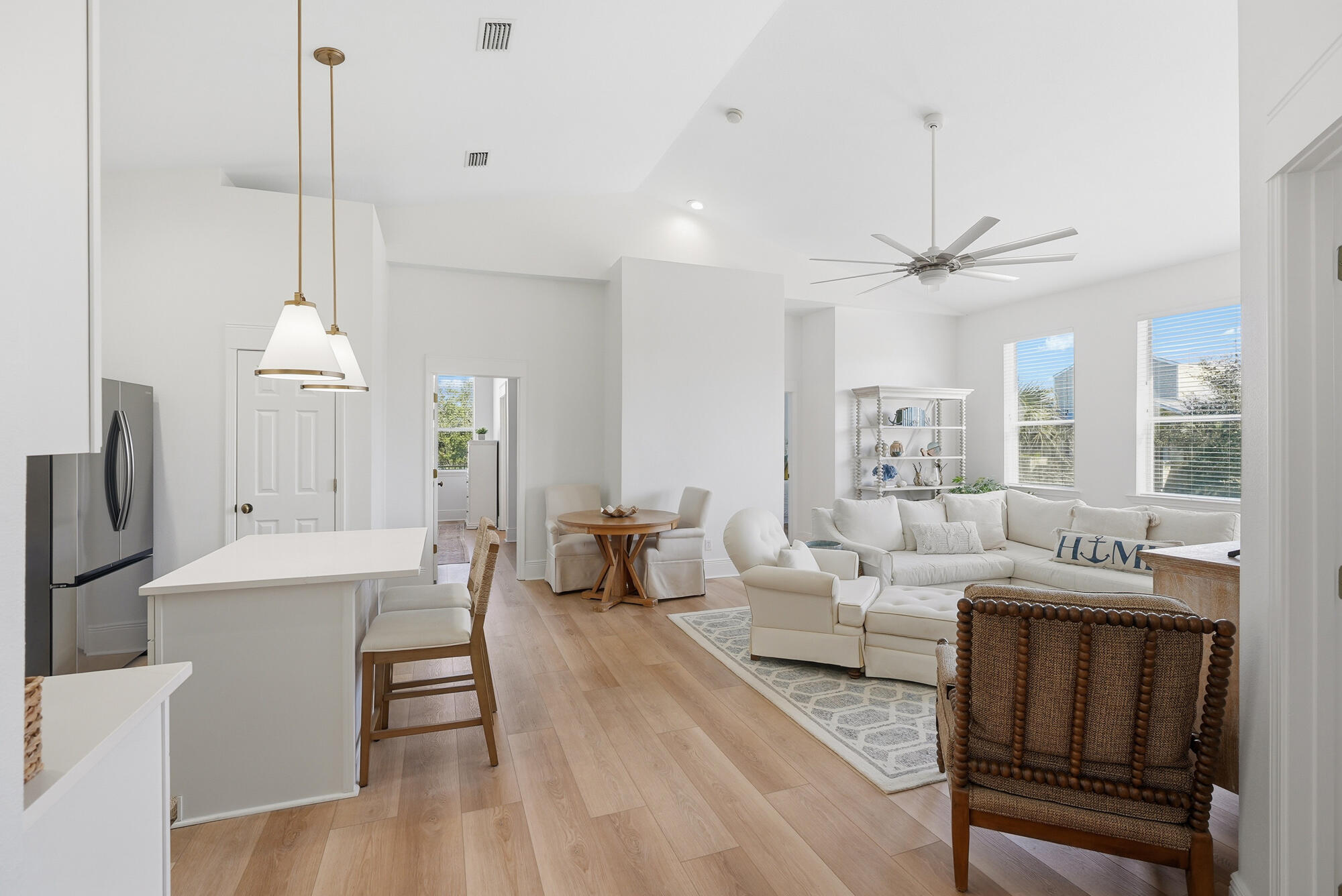 122 Shorebird Drive, Unit 821 Santa Rosa Beach, FL 32459 - Photo 2 of 36 a living room with furniture a chandelier and a flat screen tv