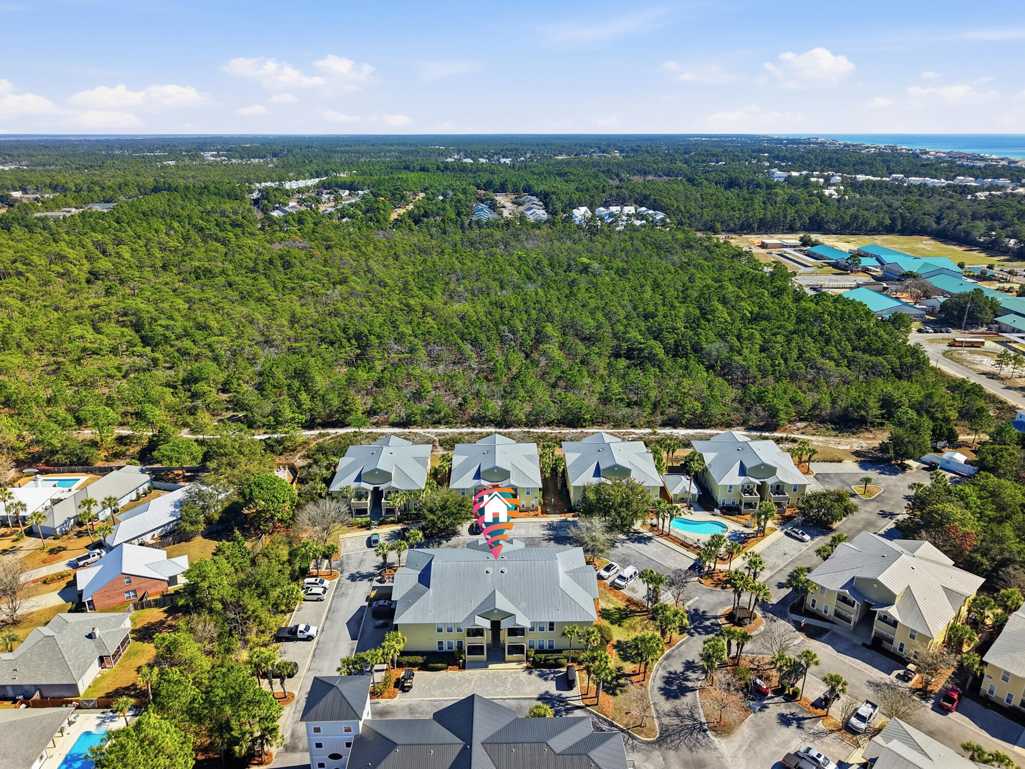122 Shorebird Drive, Unit 821 Santa Rosa Beach, FL 32459 - Photo 32 of 36 an aerial view of residential houses with outdoor space and trees