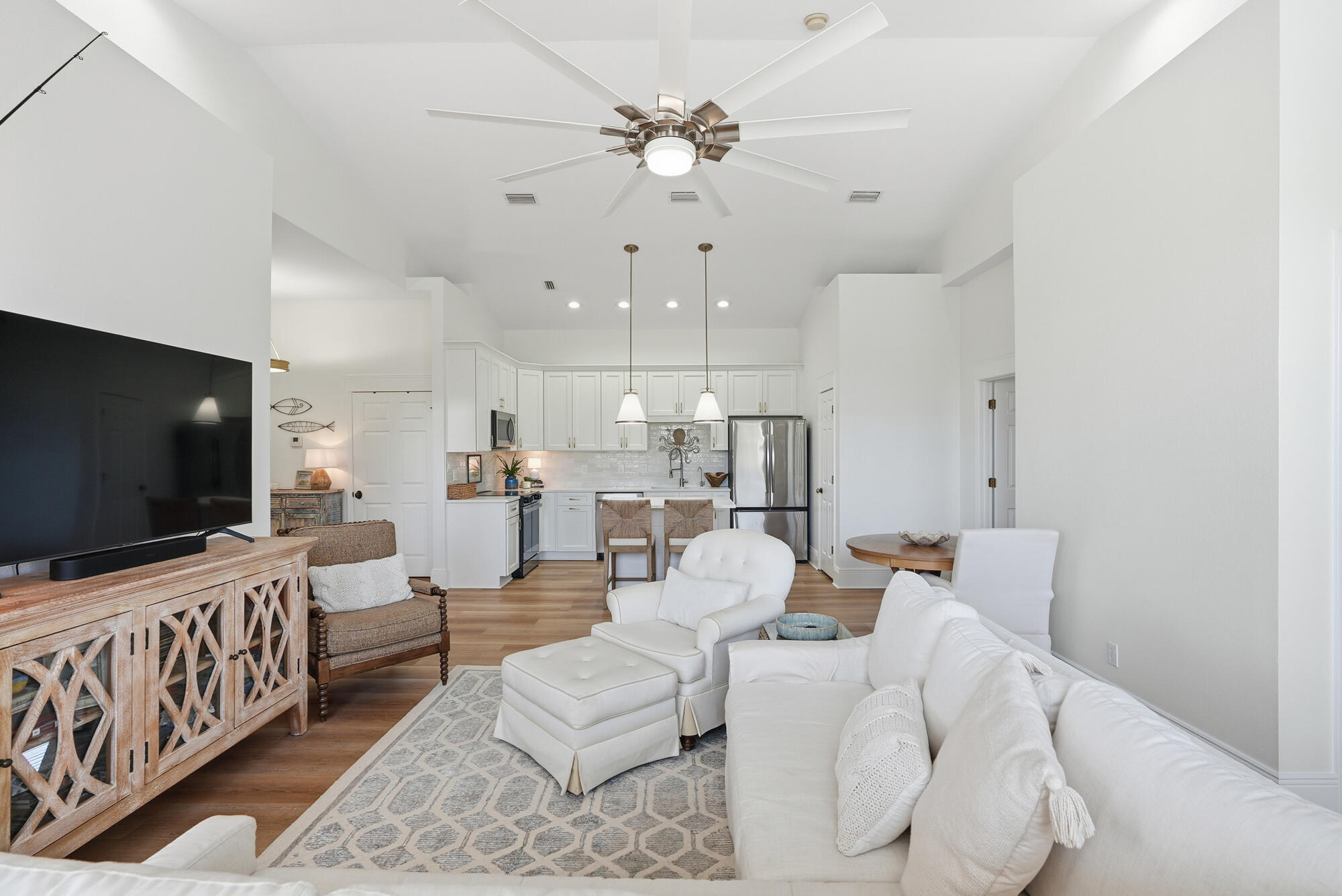 122 Shorebird Drive, Unit 821 Santa Rosa Beach, FL 32459 - Photo 5 of 36 a living room with furniture and a flat screen tv
