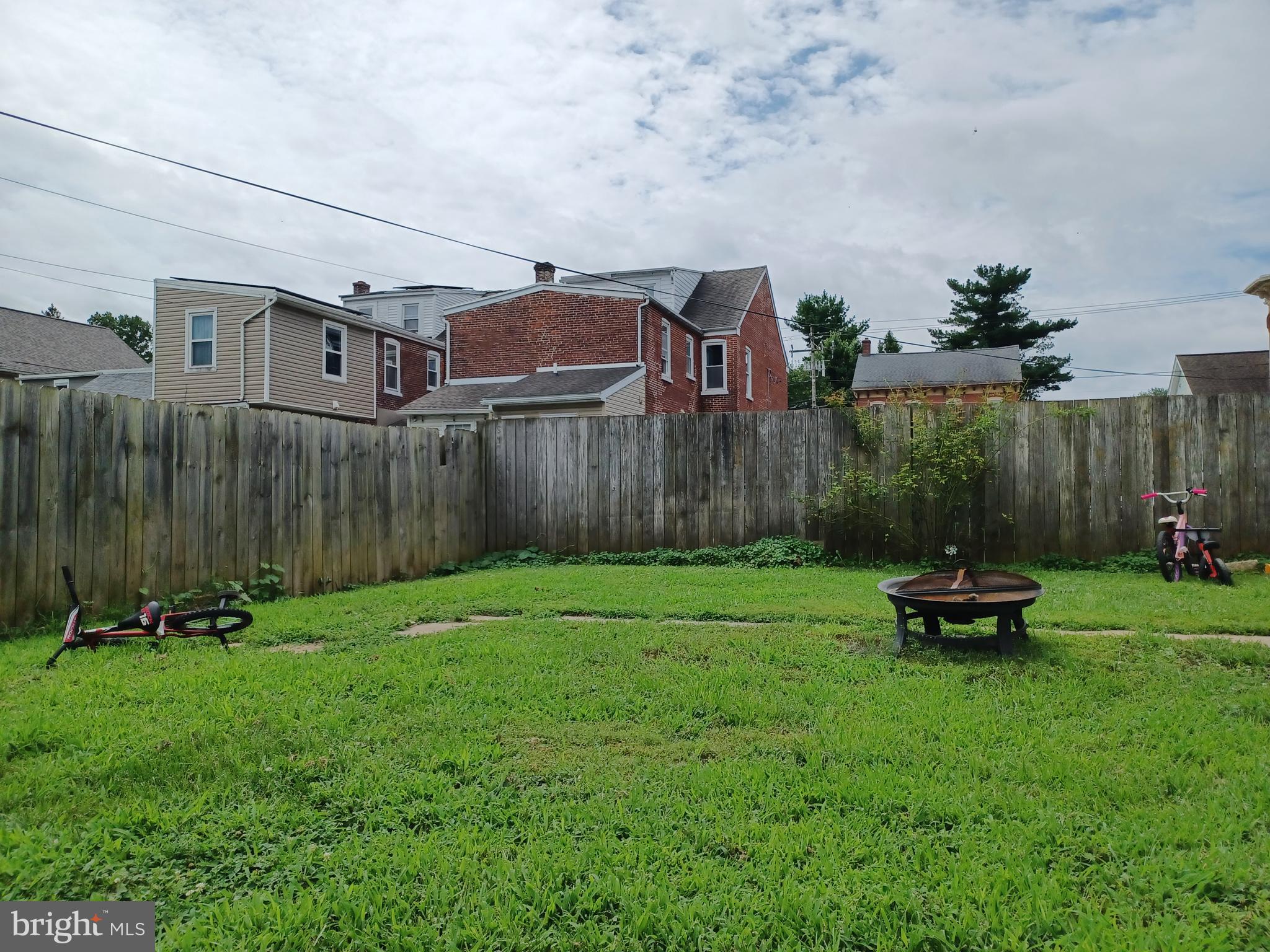 43 West Ferdinand Street Manheim, PA 17545 - Photo 18 of 23 a backyard of a house with a garden and barbeque oven