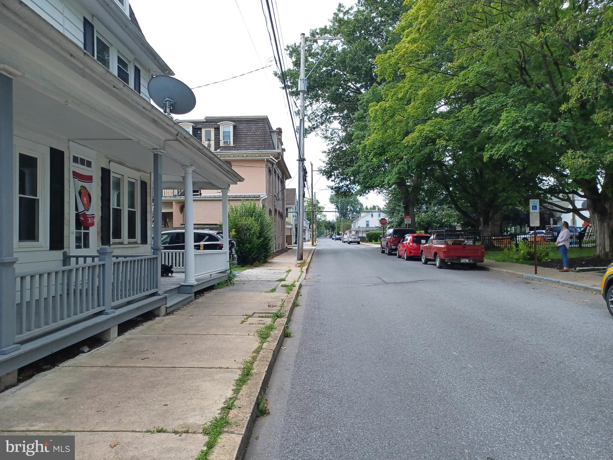 43 West Ferdinand Street Manheim, PA 17545 - Photo 23 of 23 a couple of cars parked in front of brick building