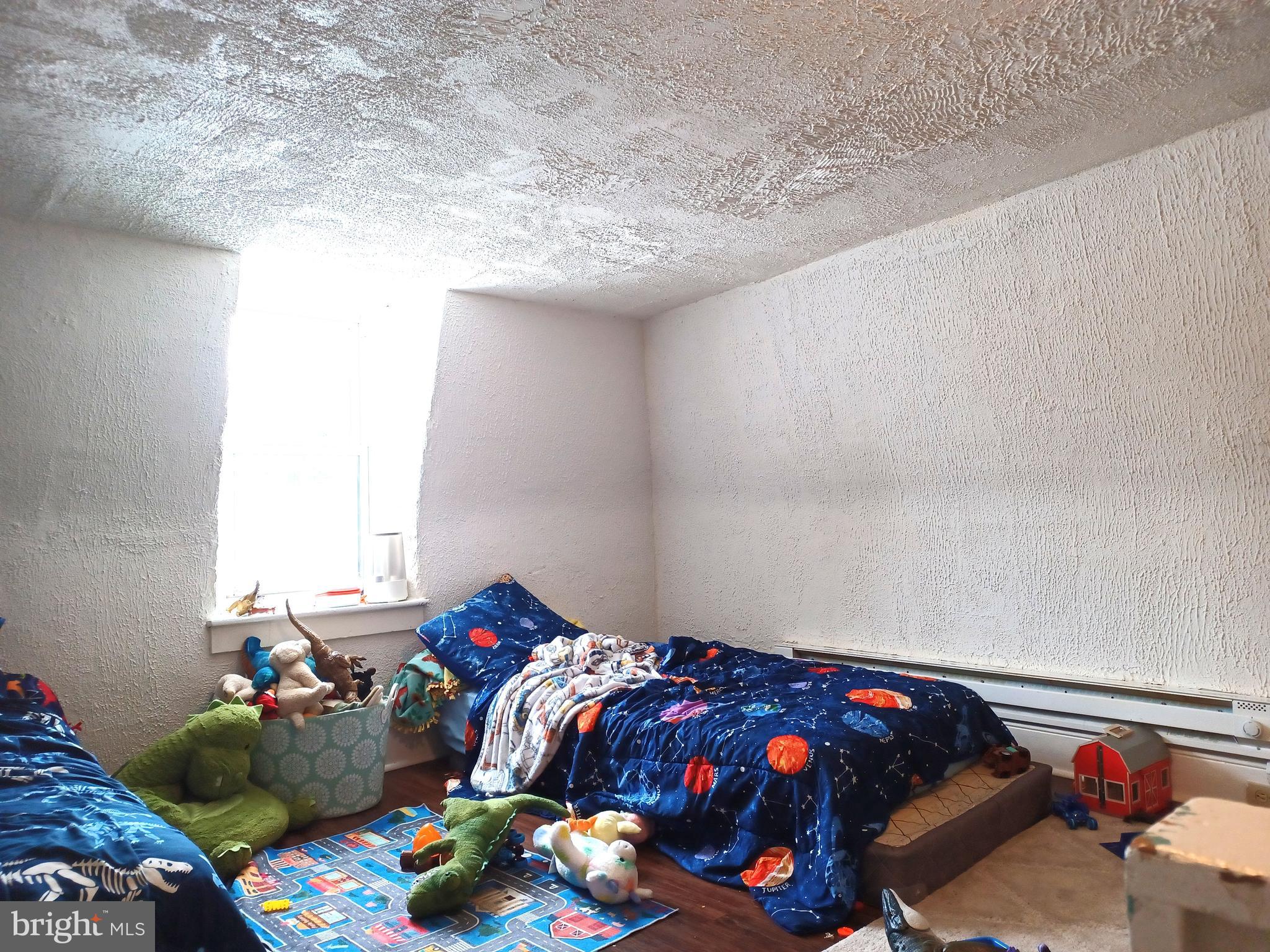 43 West Ferdinand Street Manheim, PA 17545 - Photo 8 of 23 a bedroom with a bed and a dresser