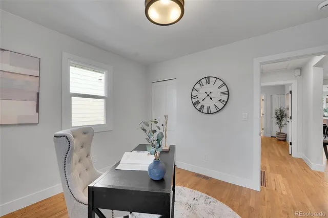 a view of a dining room with furniture window and wooden floor
