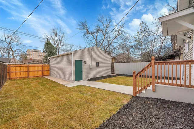a view of backyard with garage