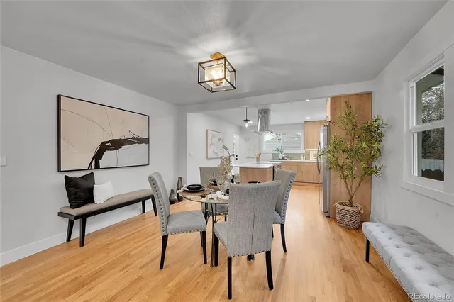 a view of a livingroom with furniture and a potted plant