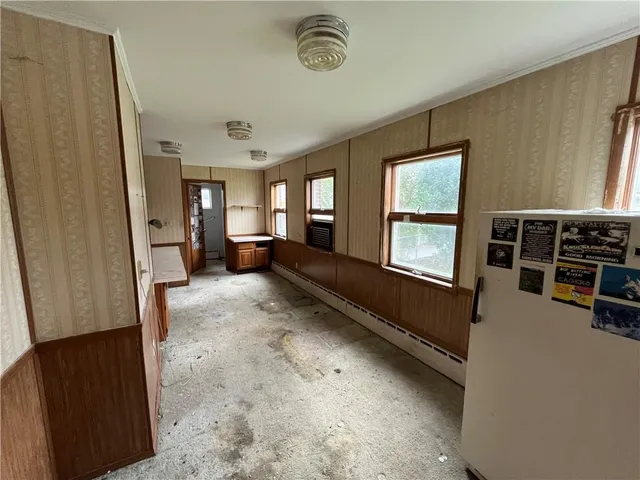 a view of living room with furniture and windows