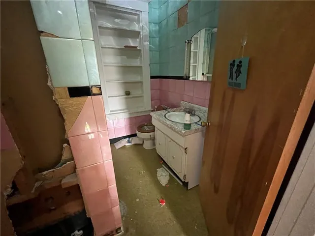 a bathroom with a sink and toilet