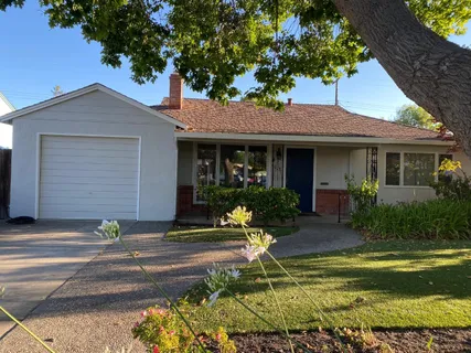 a house view with a garden space