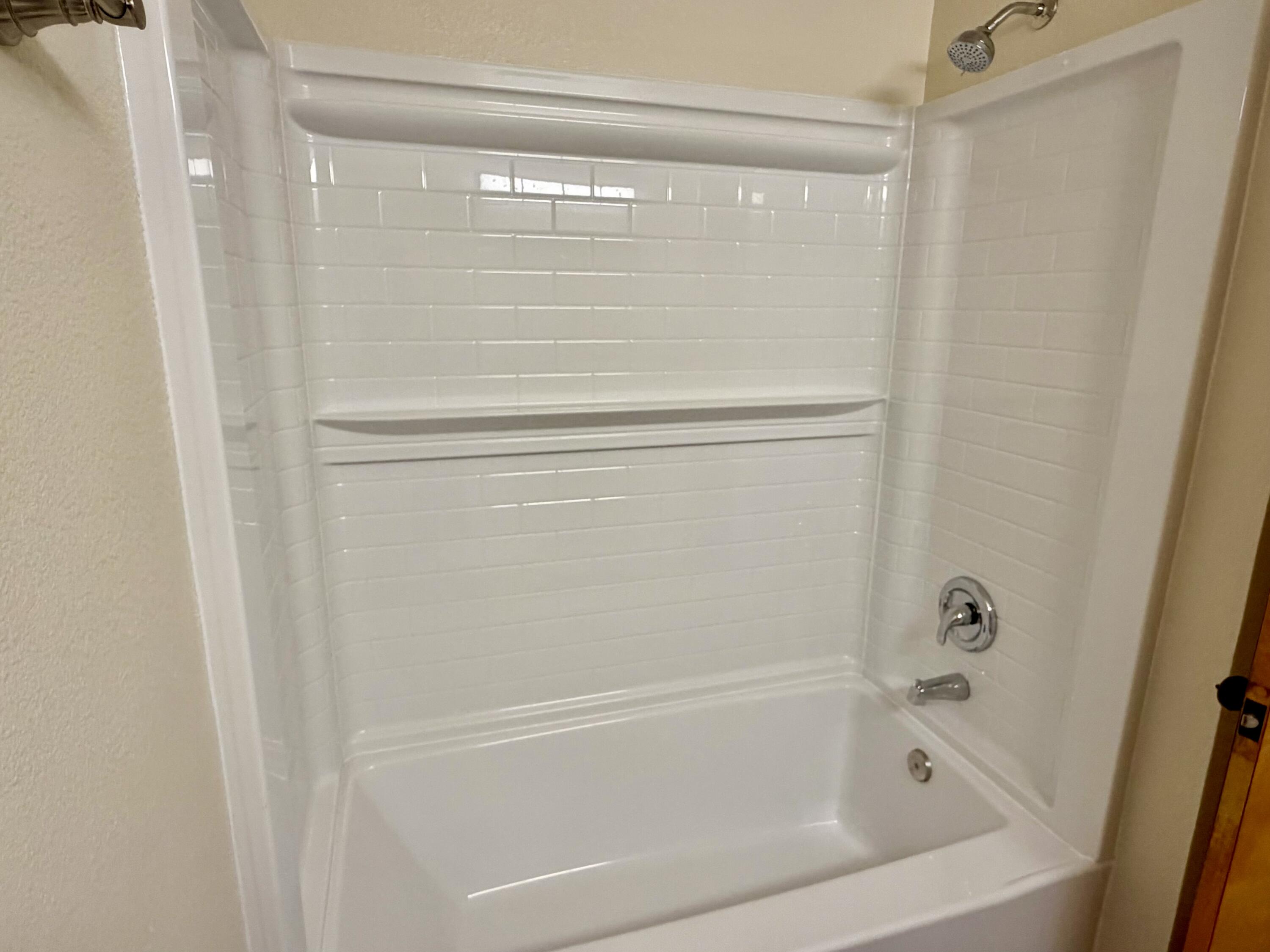 5572 Olive Street Anderson, CA 96007 - Photo 18 of 35 a close view of a bathtub in bathroom
