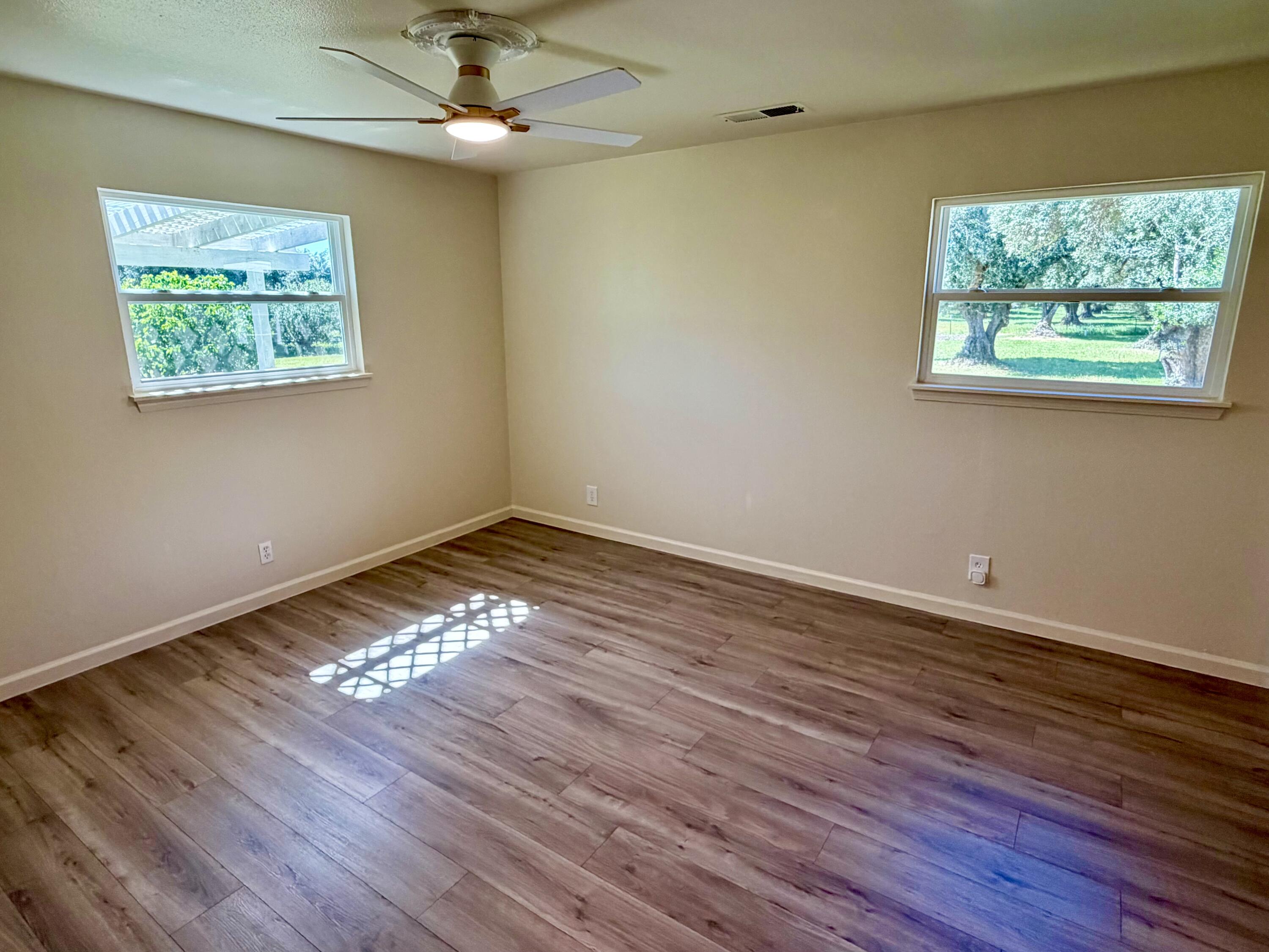 5572 Olive Street Anderson, CA 96007 - Photo 20 of 35 a view of an empty room with wooden floor and a window