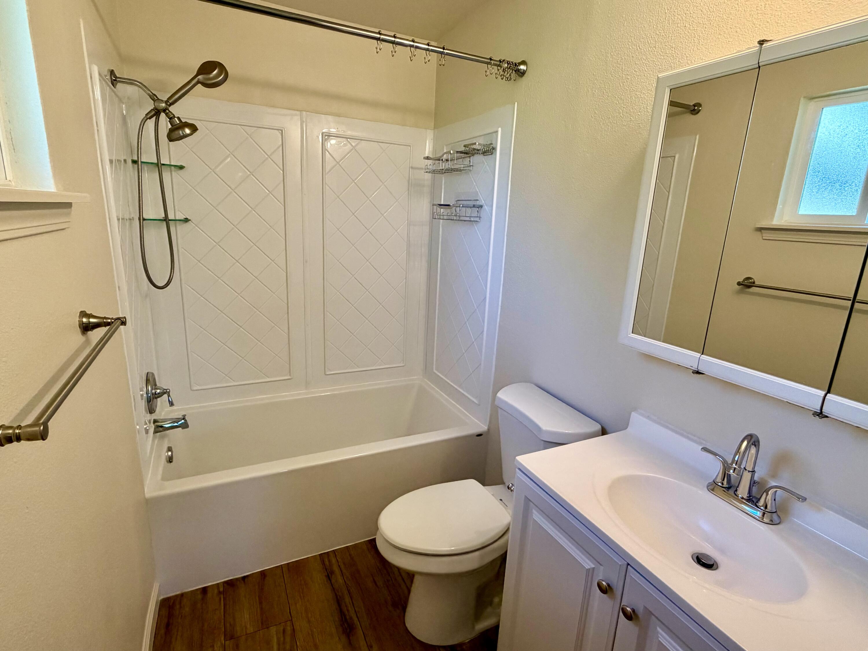 5572 Olive Street Anderson, CA 96007 - Photo 23 of 35 a bathroom with a sink toilet and shower