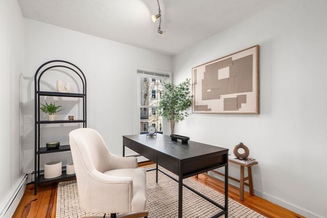 a workspace with furniture and window