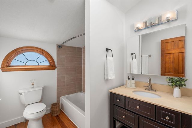 a bathroom with a sink a toilet and a bathtub
