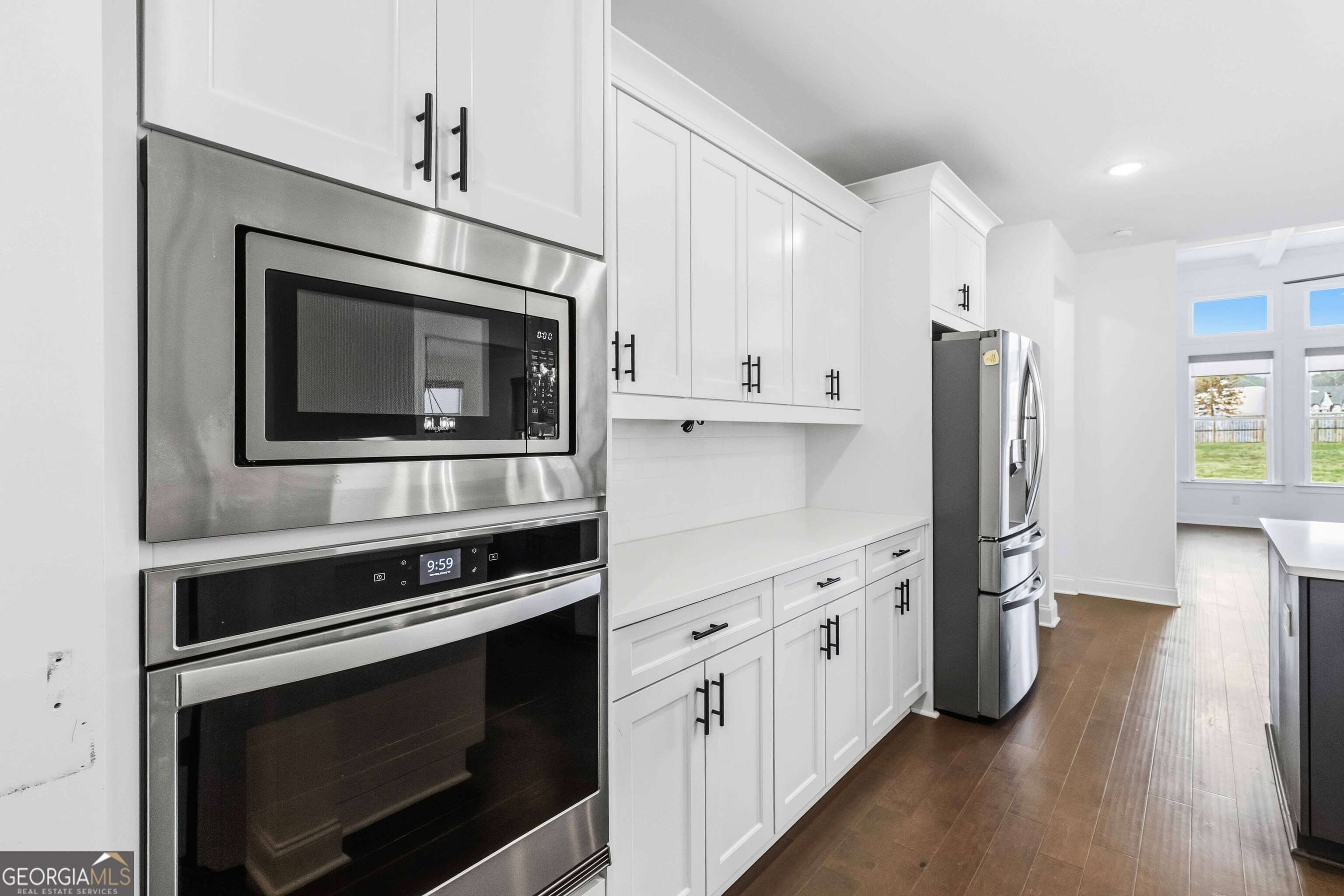 2950 Stone Road Watkinsville, GA 30677 - Photo 15 of 53 a kitchen with stainless steel appliances a stove microwave and refrigerator