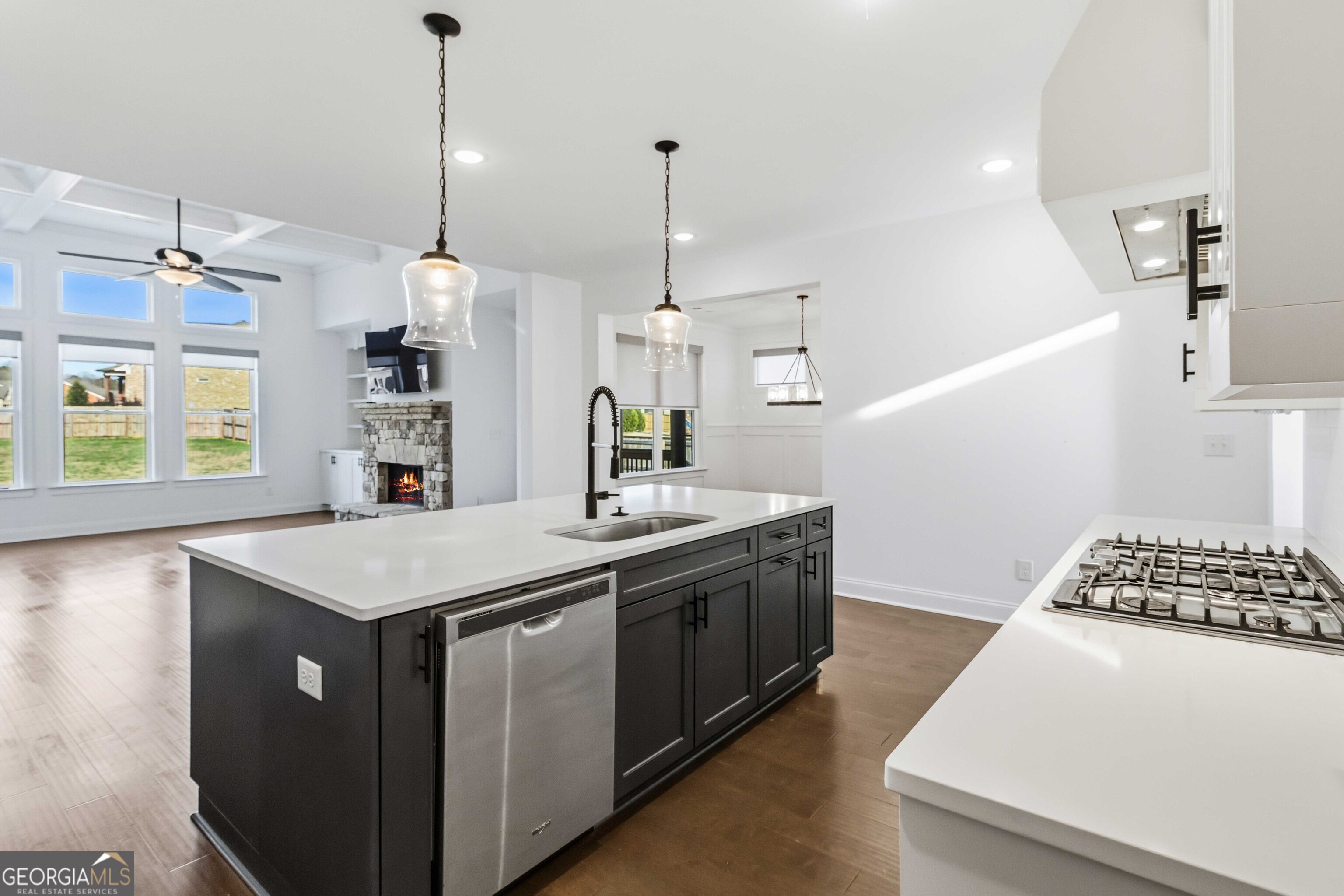 2950 Stone Road Watkinsville, GA 30677 - Photo 16 of 53 a kitchen that has a sink a stove and a wooden floor