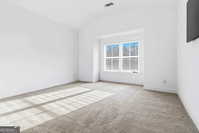 an empty room with windows