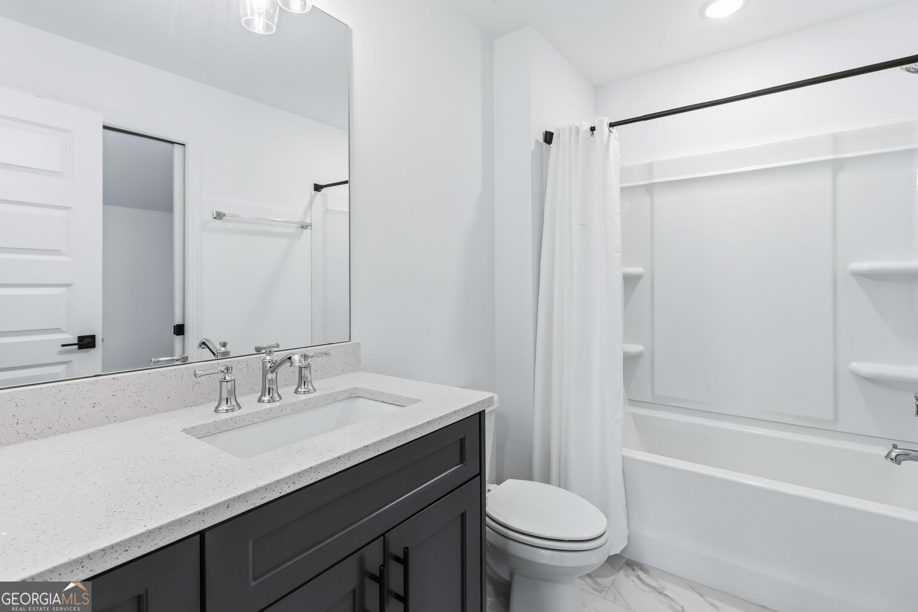 2950 Stone Road Watkinsville, GA 30677 - Photo 35 of 53 a bathroom with a sink a toilet and a large mirror