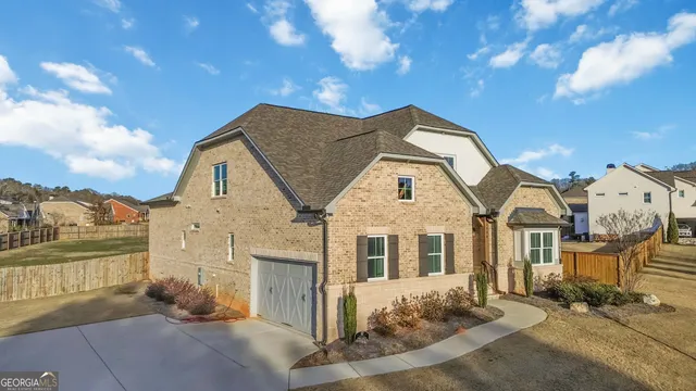 an aerial view of residential building and lake