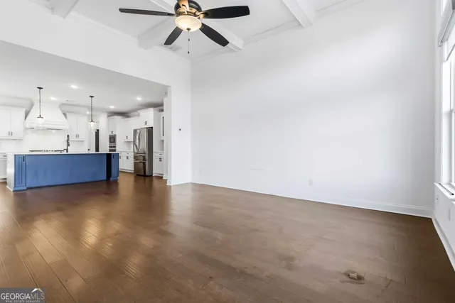 a view of a kitchen with a sink and a window