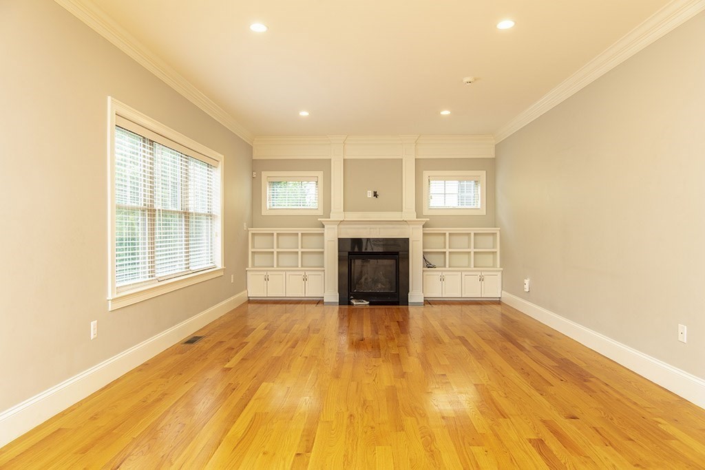 33 Liberty Avenue Lexington, MA 02420 - Photo 6 of 30 a view of an empty room with a fireplace and a window