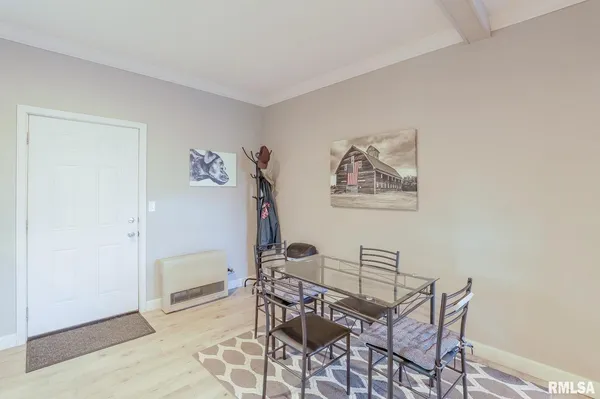 a view of a livingroom with furniture and a window