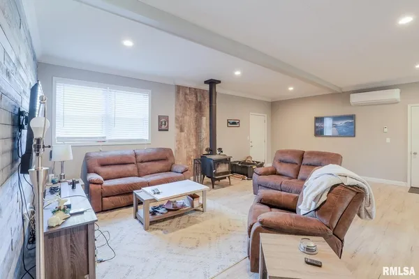 a living room with furniture and a window