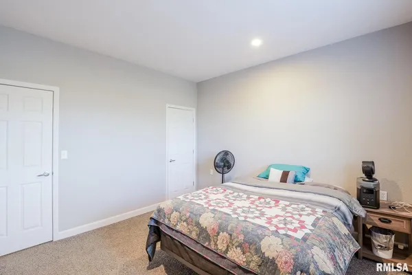 a bedroom with a bed and a closet