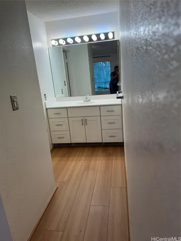 a bathroom with a sink and a mirror